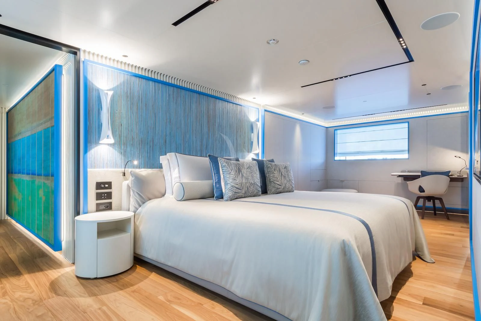 a bedroom with a bed and a desk aboard RIO Yacht for Sale