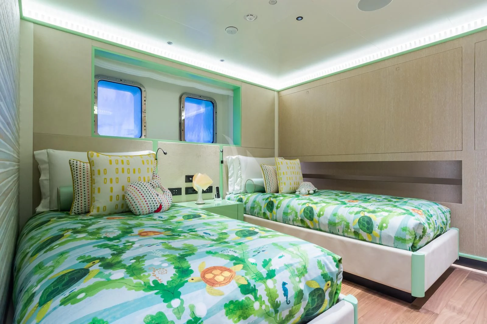 a couple of beds in a room aboard RIO Yacht for Sale