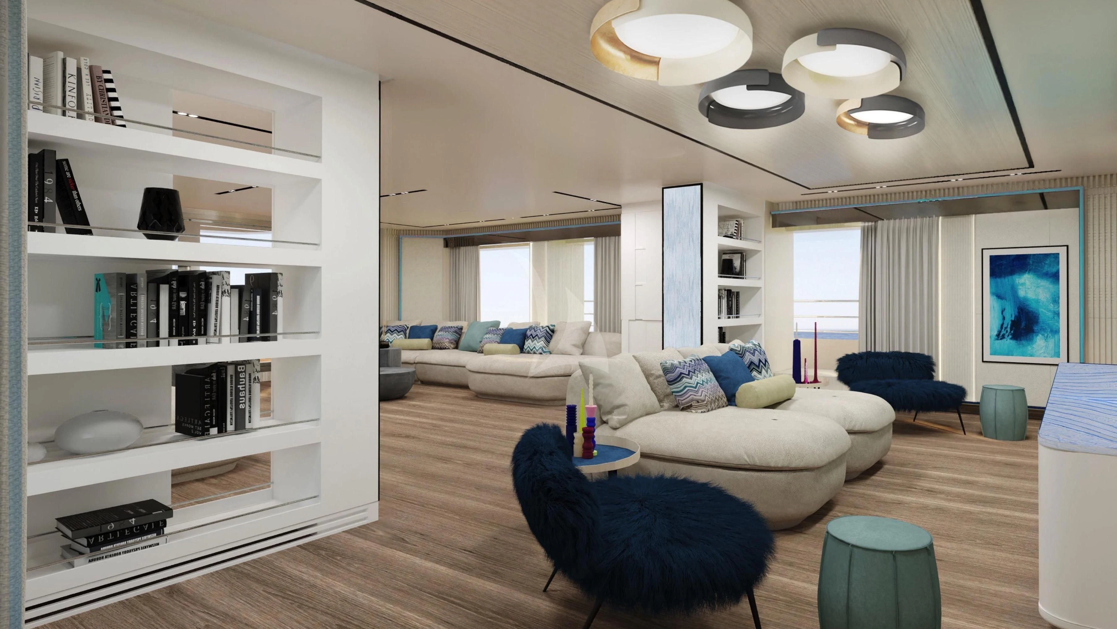a living room with a large white bookcase and a blue chair aboard RIO Yacht for Sale