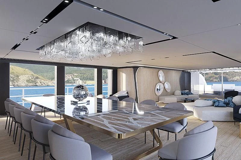 a large living room with a large white table and chairs aboard RIO Yacht for Sale