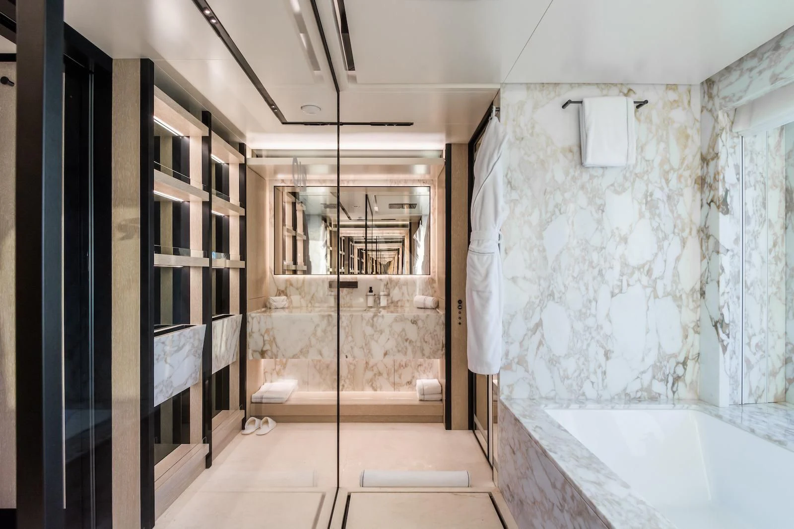 a bathroom with a tub and shower aboard RIO Yacht for Sale