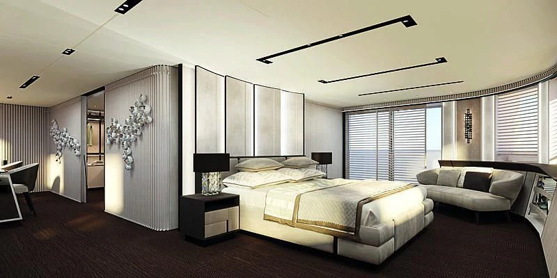 a large bedroom with a bed and a couch aboard RIO Yacht for Sale