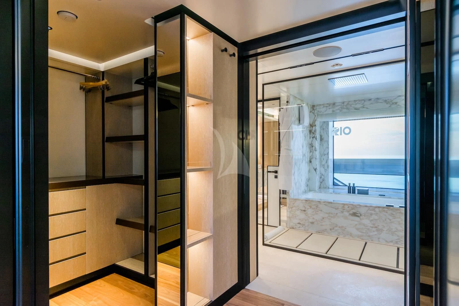 a room with a glass door aboard RIO Yacht for Sale