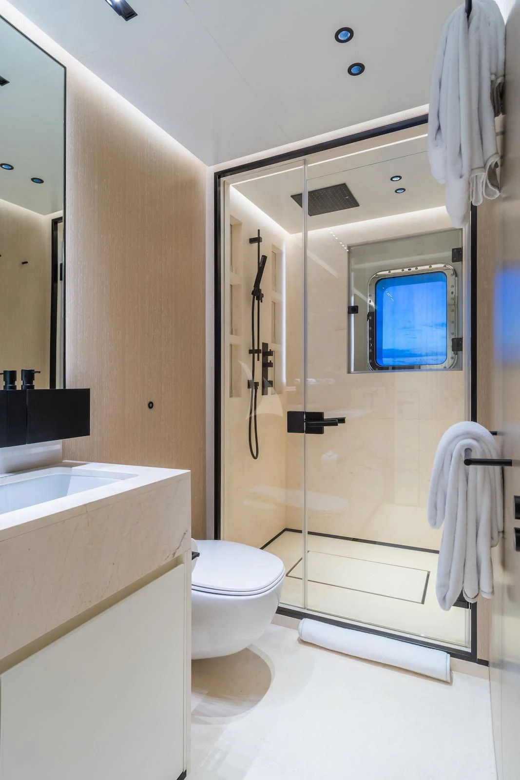 a bathroom with a shower unit and toilet aboard RIO Yacht for Sale