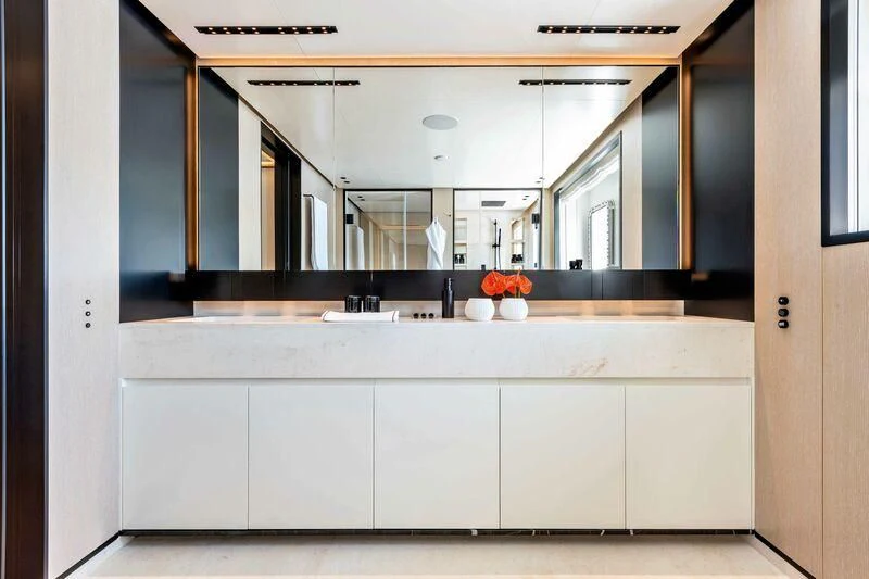 a kitchen with white cabinets aboard RIO Yacht for Sale