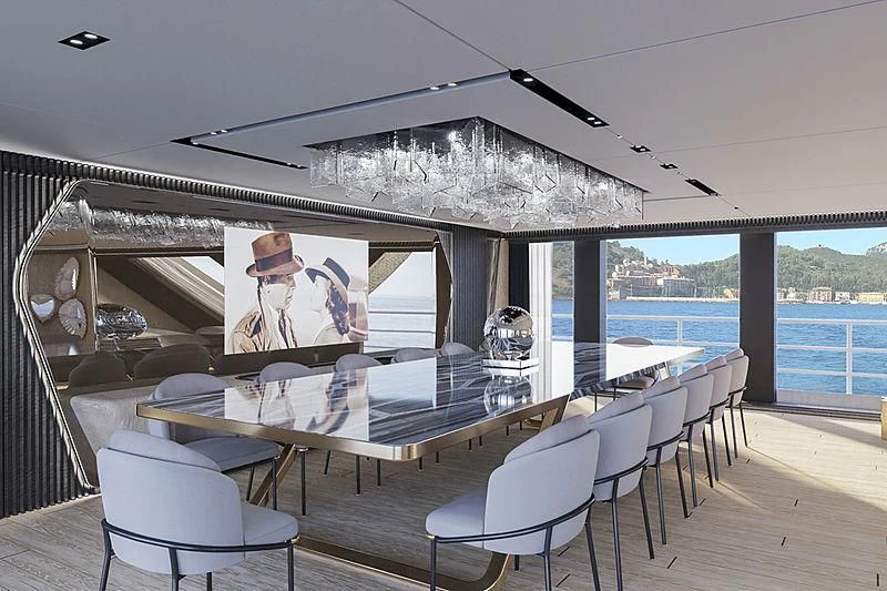 a room with a table and chairs aboard RIO Yacht for Sale