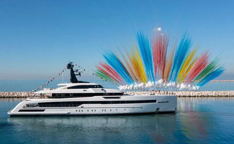 a boat with a rainbow in the background aboard RIO Yacht for Sale