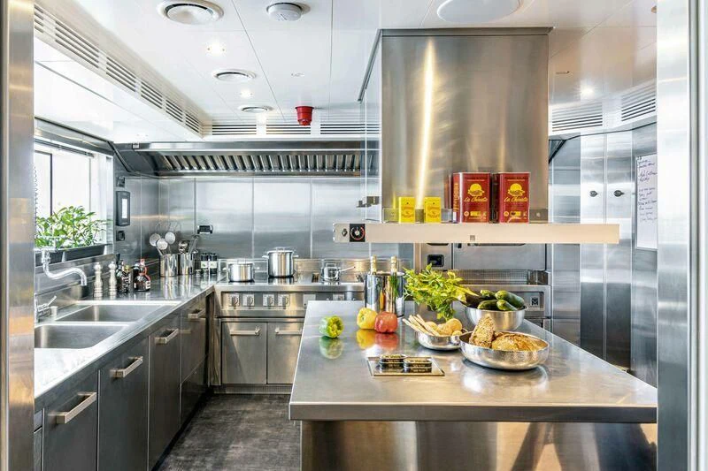 a kitchen with a large island aboard RIO Yacht for Sale