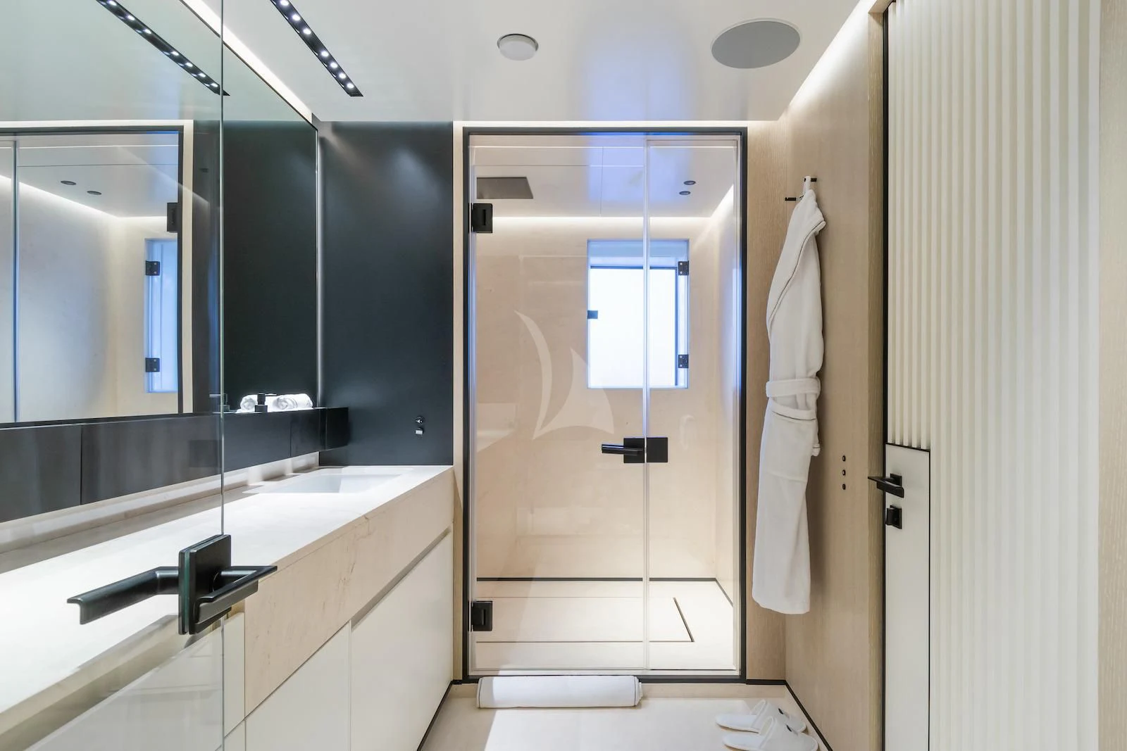 a bathroom with a glass shower aboard RIO Yacht for Sale