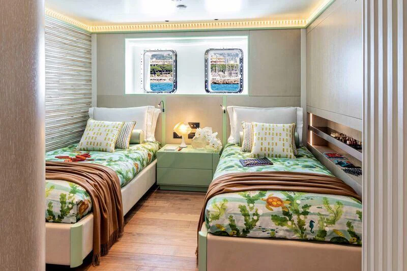 a couple of beds in a room aboard RIO Yacht for Sale
