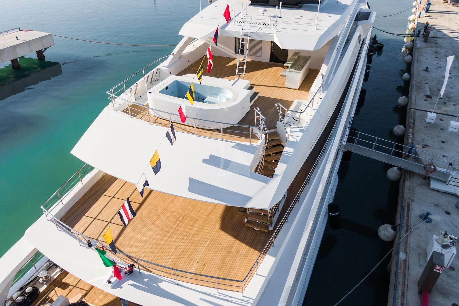 a large white boat on a dock aboard RIO Yacht for Sale