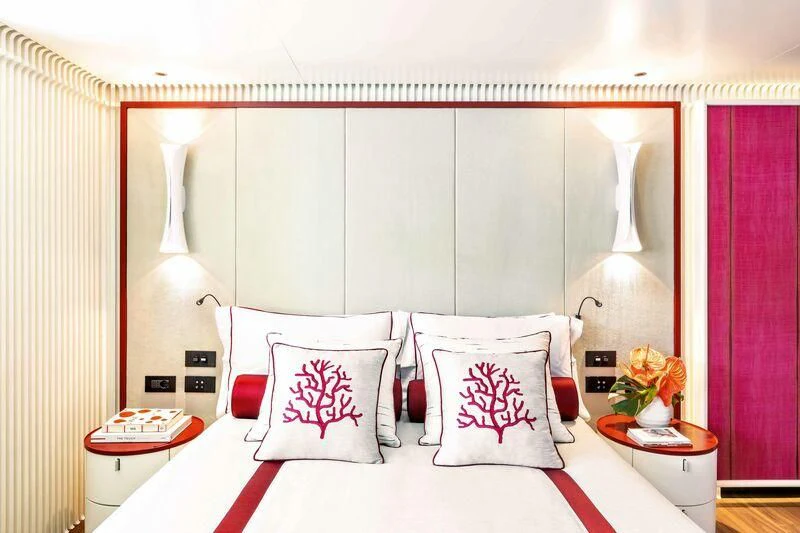 a bed with white pillows aboard RIO Yacht for Sale