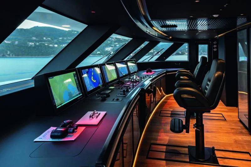 a control room with multiple monitors aboard RIO Yacht for Sale