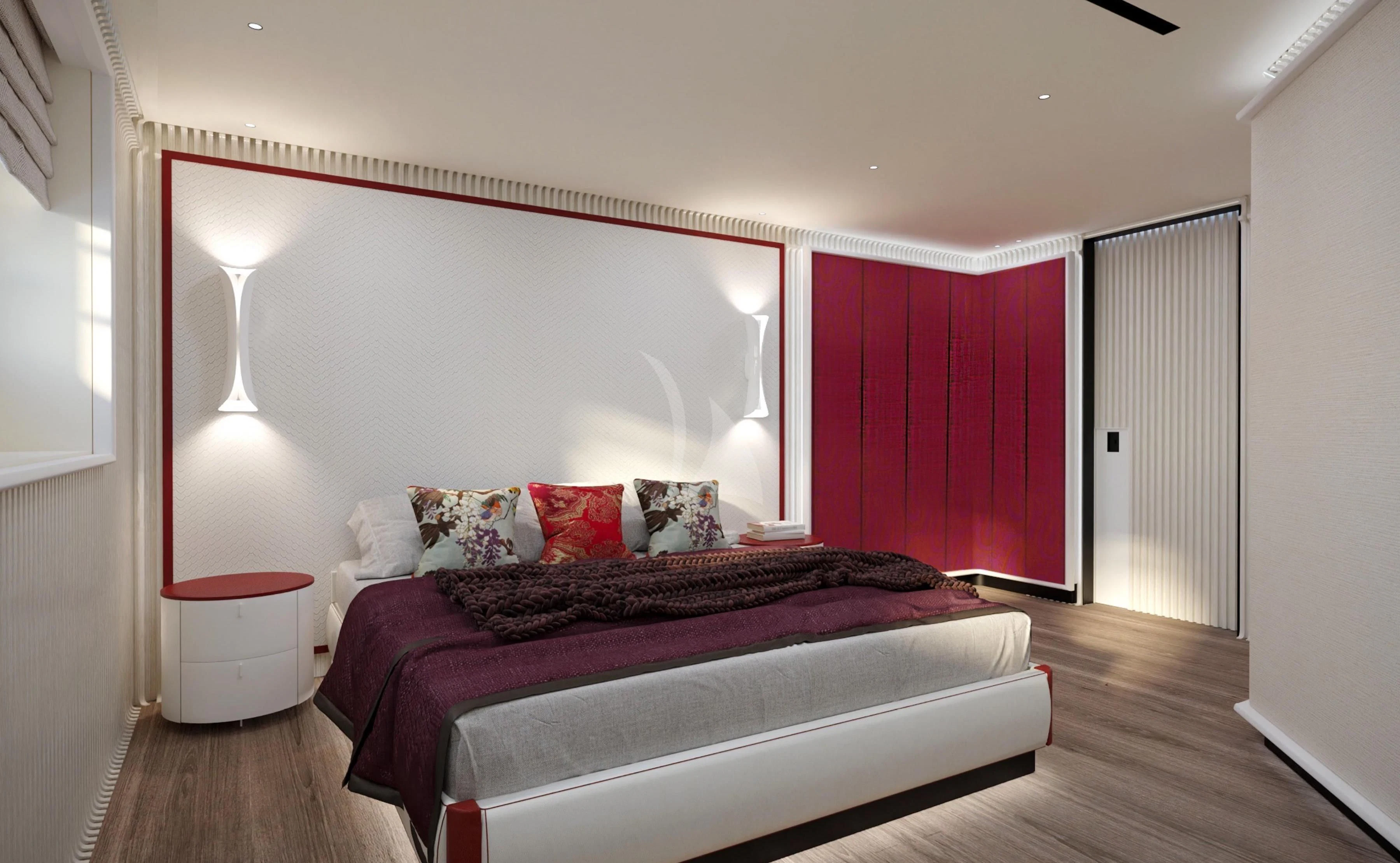 a bed with a red wall aboard RIO Yacht for Sale