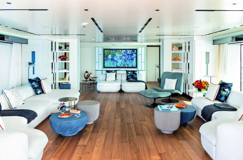 a living room with a large screen aboard RIO Yacht for Sale