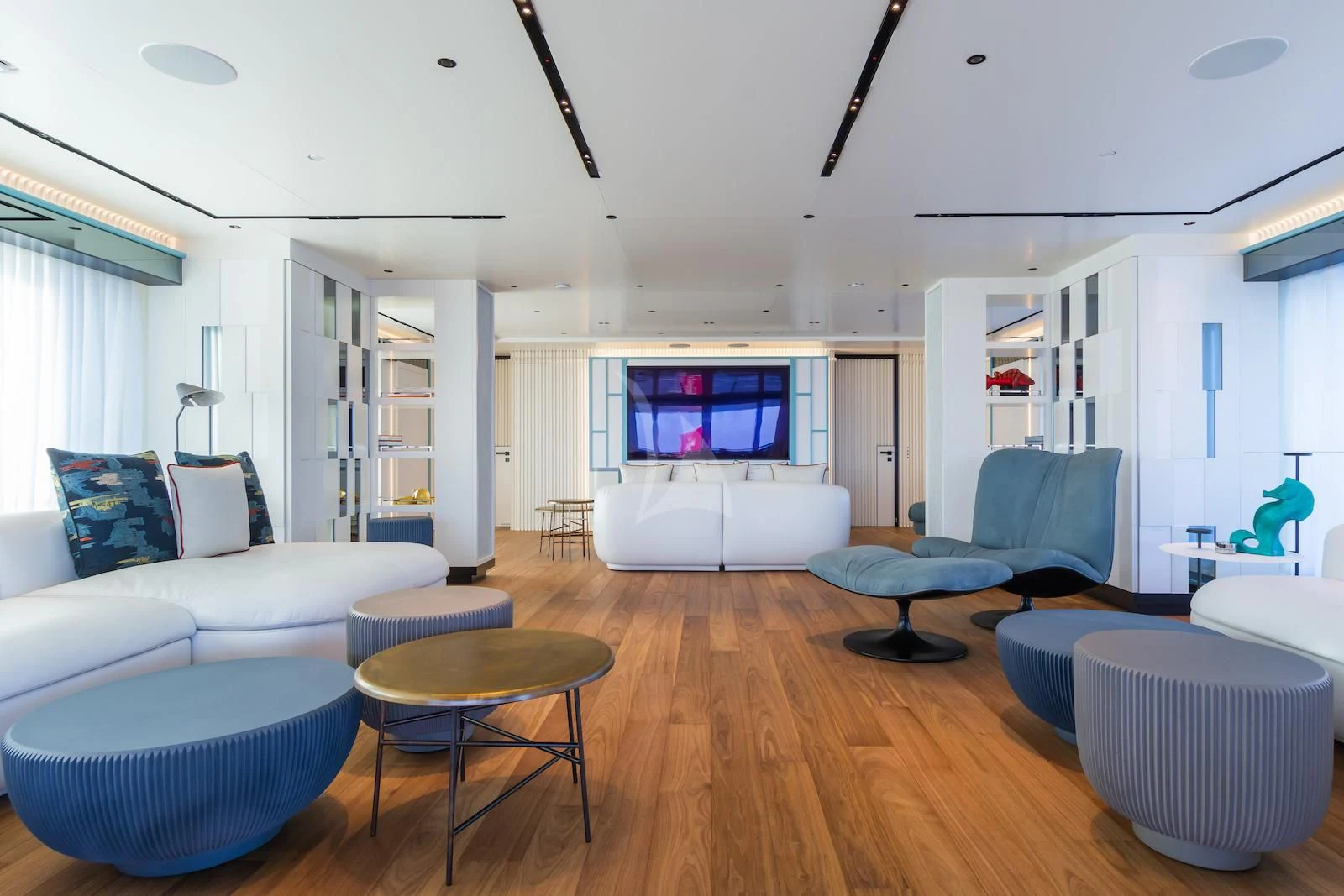 a living room with a wood floor aboard RIO Yacht for Sale