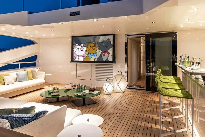 a living room with a couch and a table aboard RIO Yacht for Sale