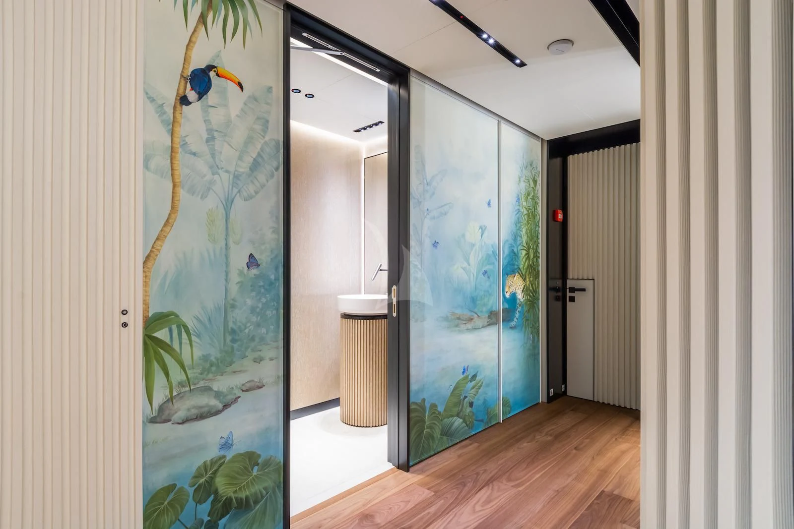 a room with a glass door and a fish tank aboard RIO Yacht for Sale
