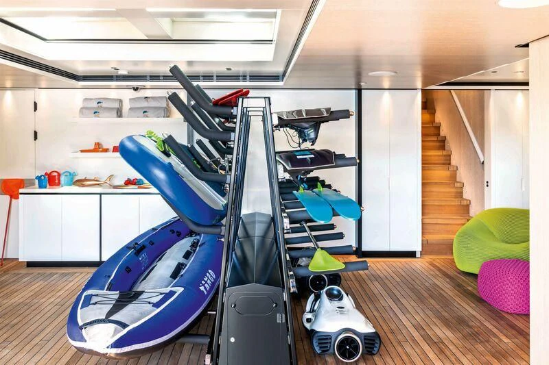 a room with exercise equipment aboard RIO Yacht for Sale