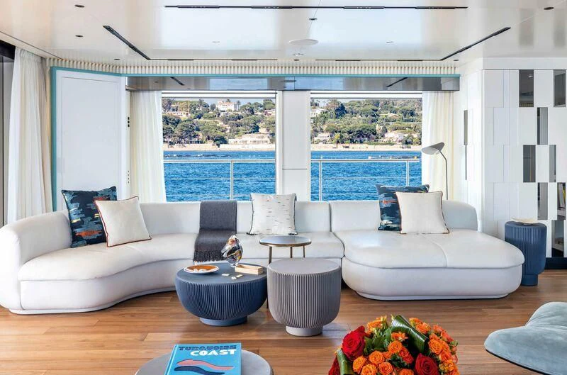 a living room with a large window aboard RIO Yacht for Sale