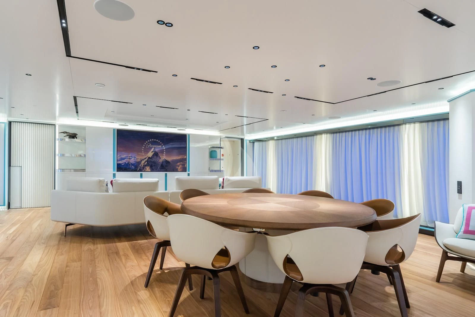 a room with a table and chairs aboard RIO Yacht for Sale