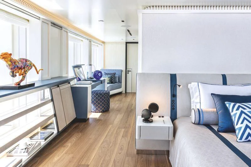 a bedroom with a large mirror aboard RIO Yacht for Sale