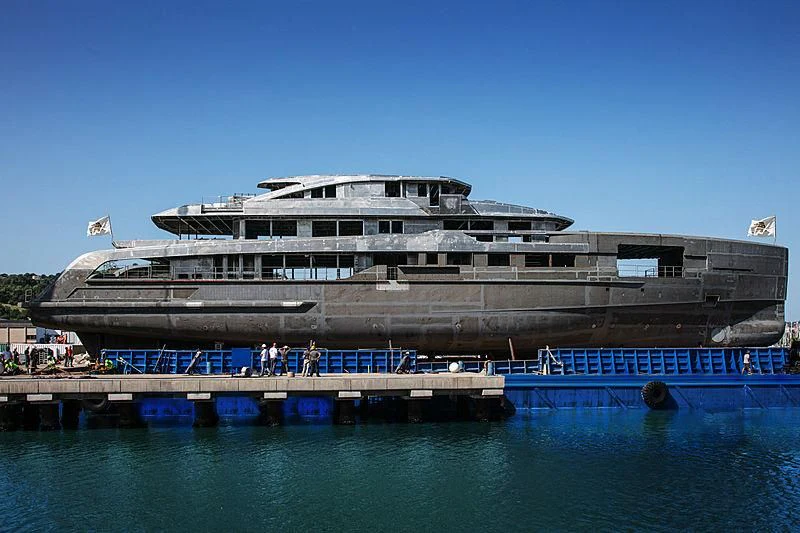 a large cruise ship docked aboard RIO Yacht for Sale