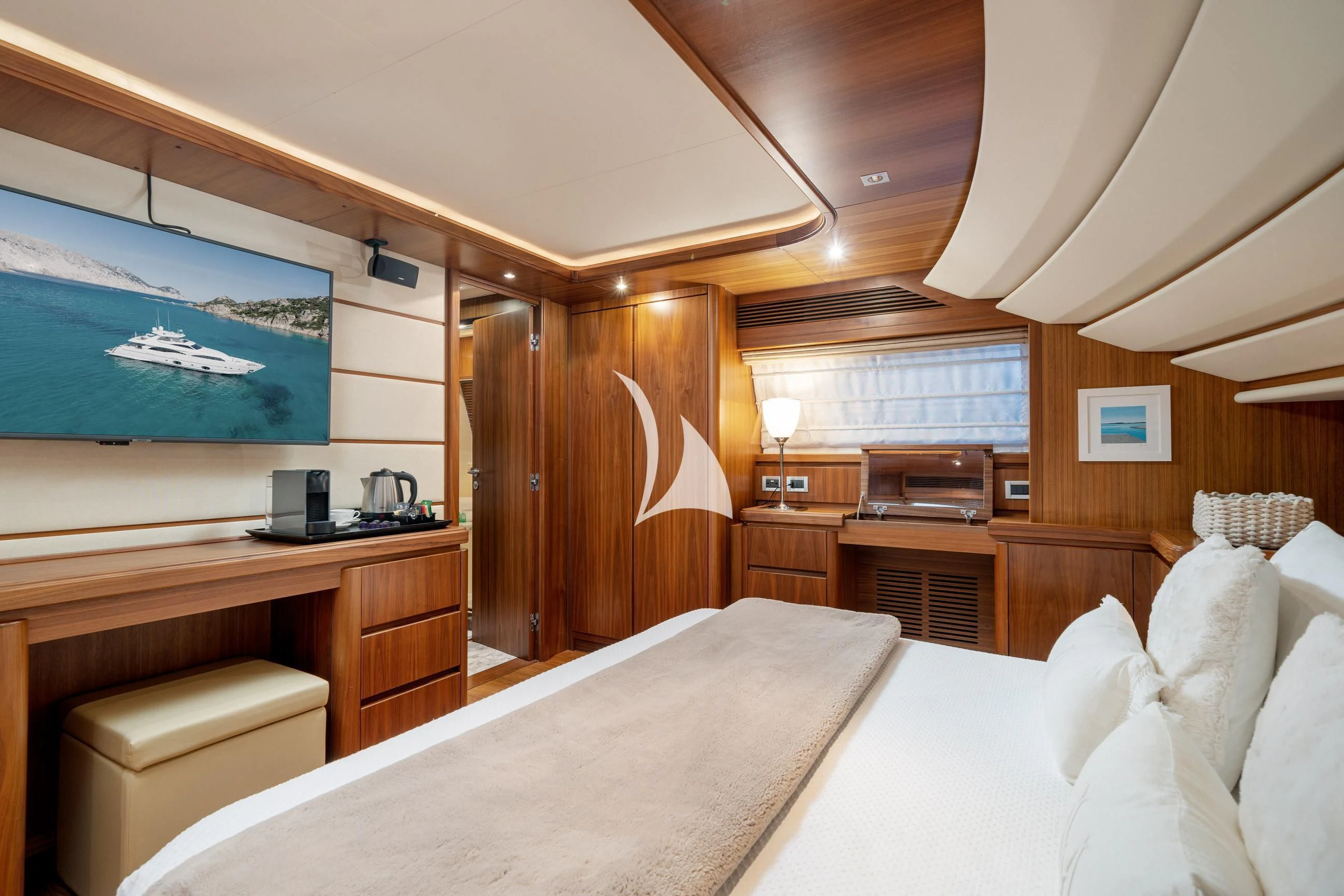 a room with a bed and a desk aboard ETHNA Yacht for Sale