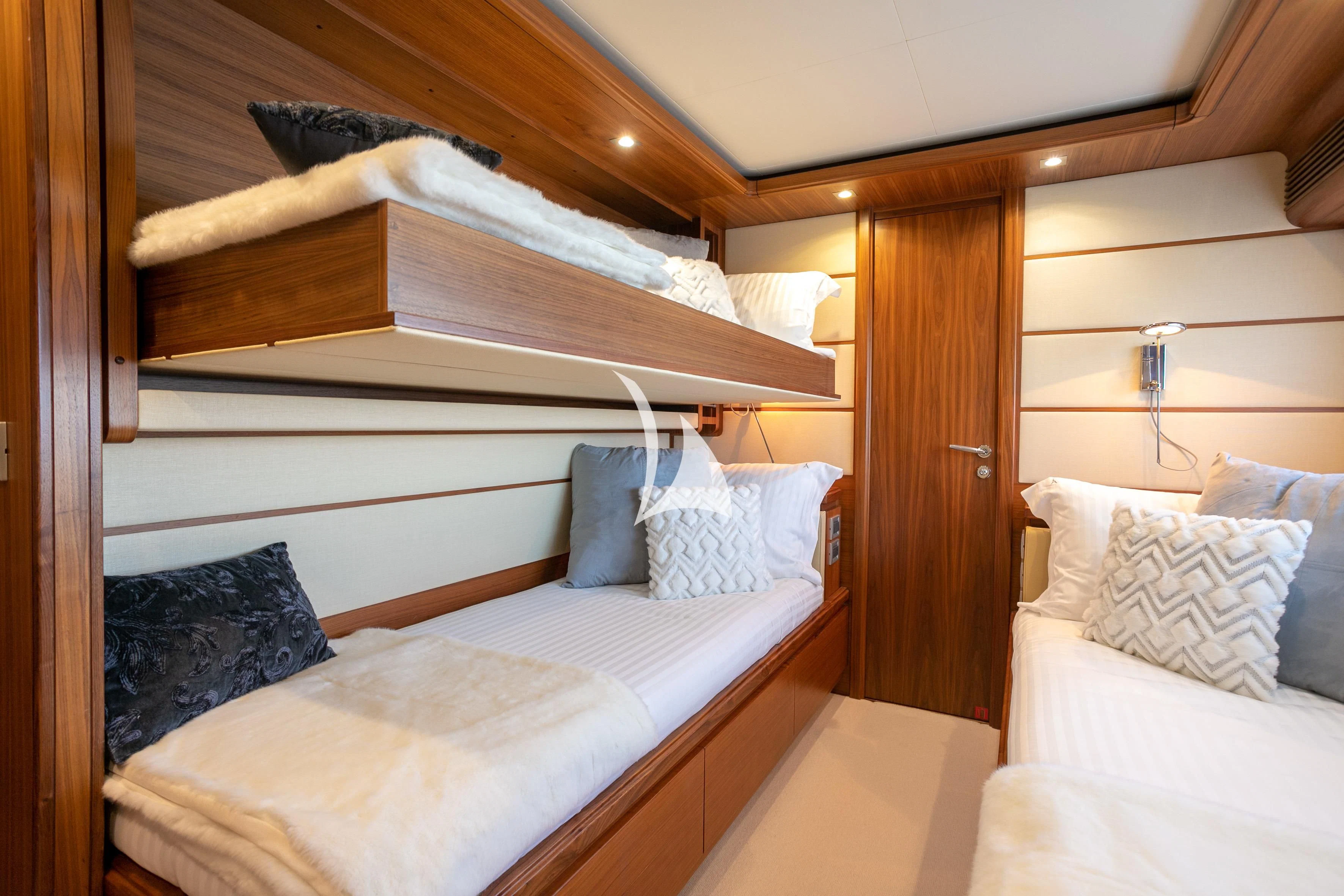 a room with a bed and a wood door aboard ETHNA Yacht for Sale