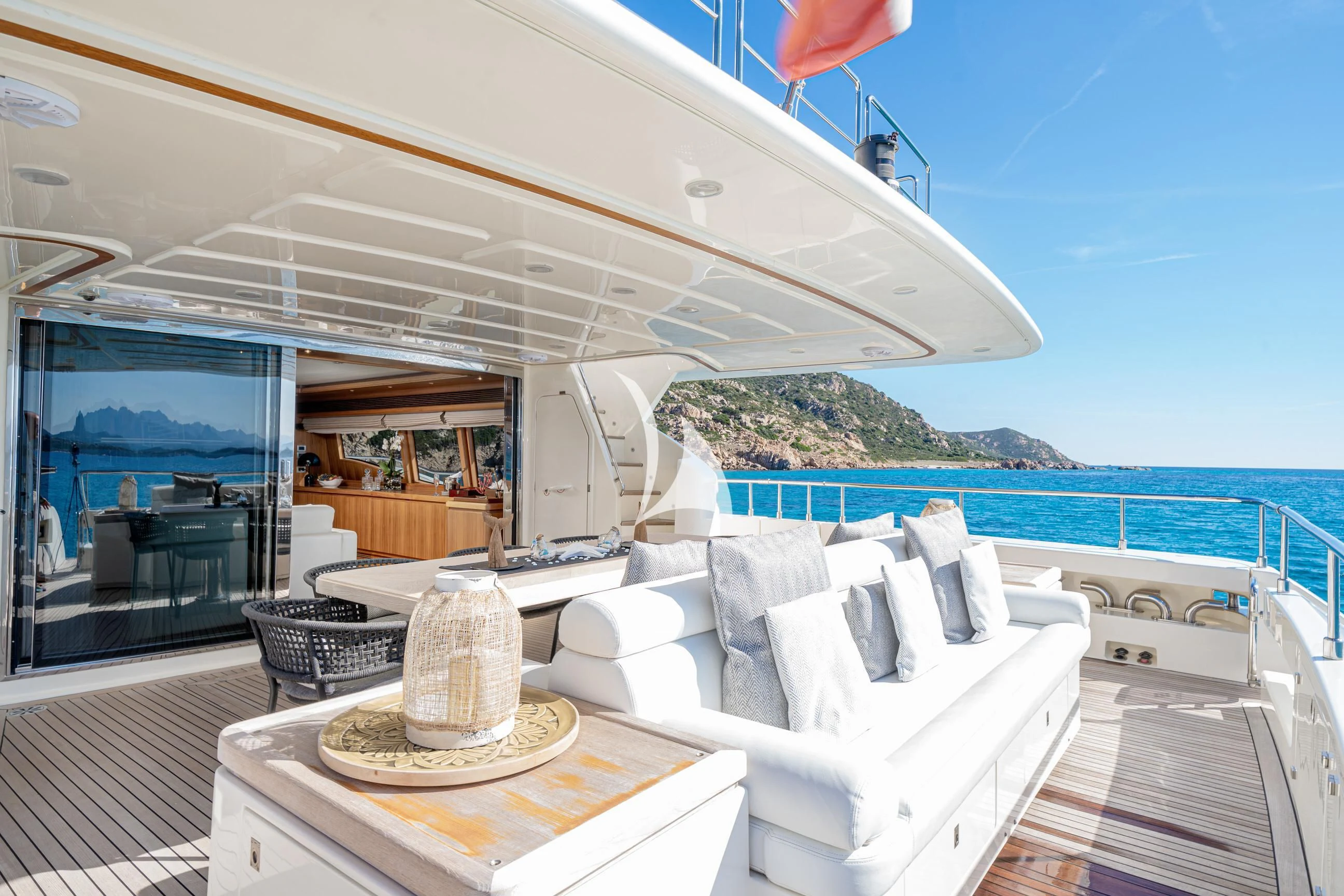 a large white bed on a deck aboard ETHNA Yacht for Sale