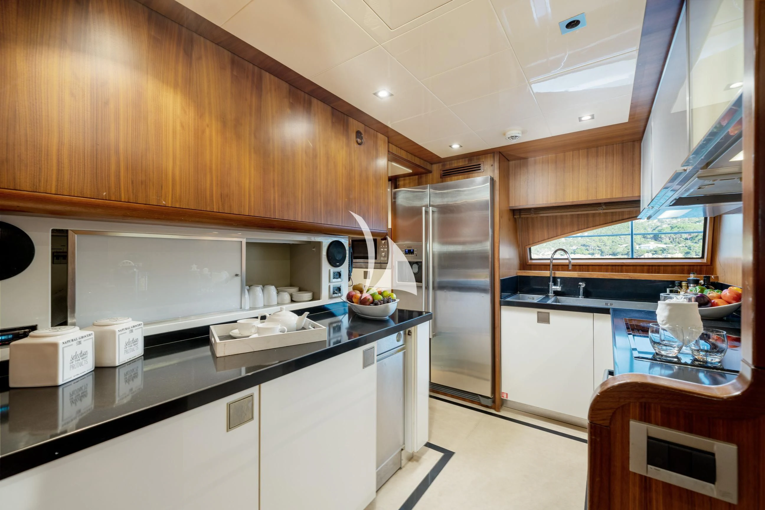 a kitchen with a refrigerator and a sink aboard ETHNA Yacht for Sale