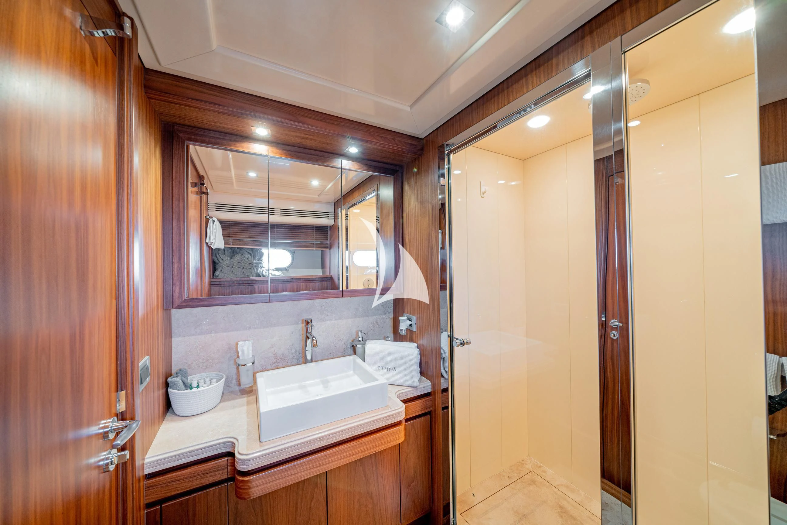 a bathroom with a sink and a mirror aboard ETHNA Yacht for Sale