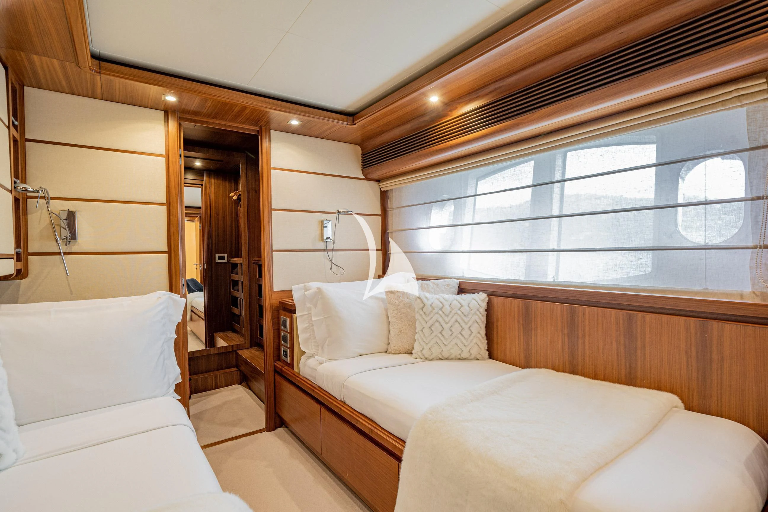a room with a bed and a window aboard ETHNA Yacht for Sale