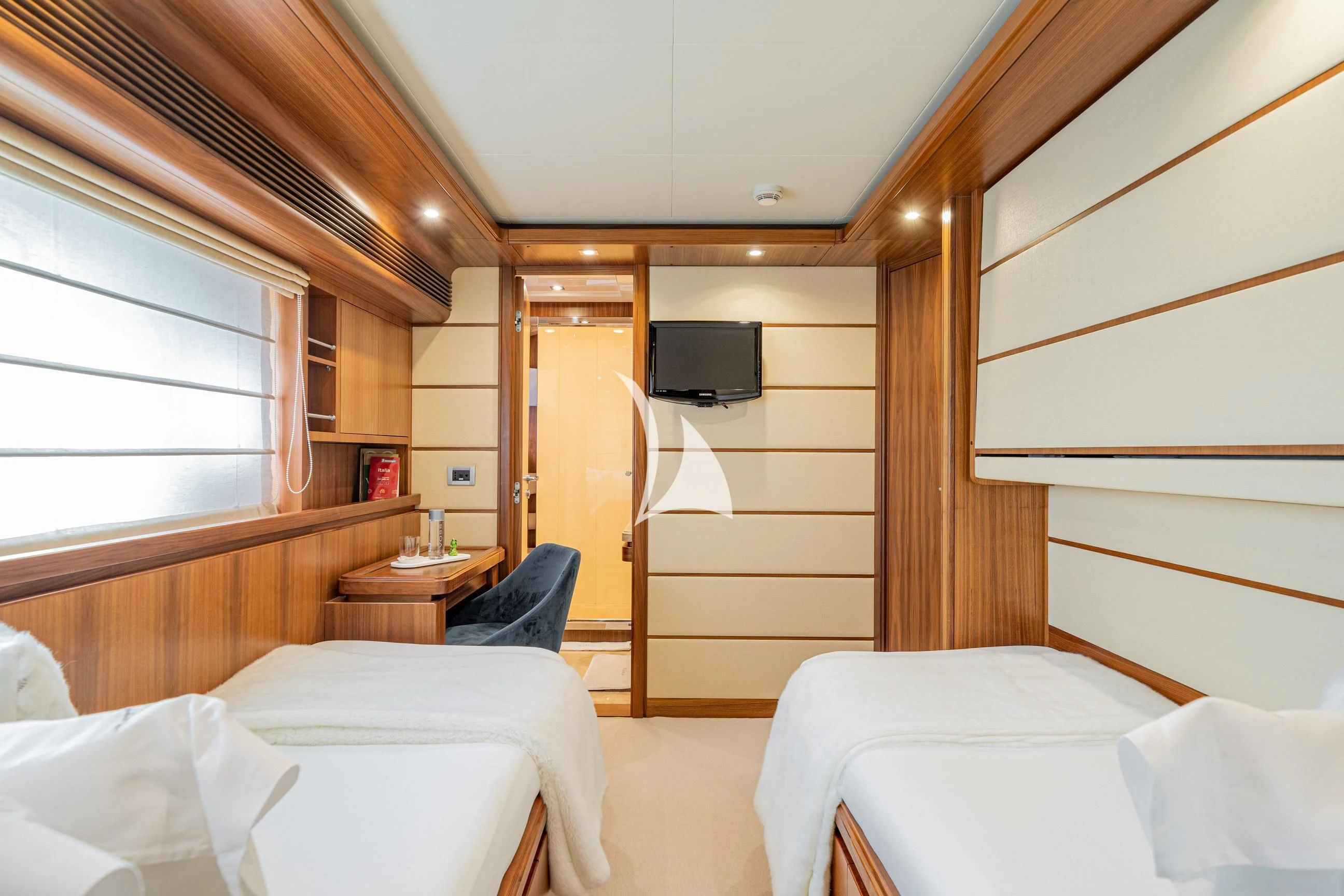 a room with a bed and a television aboard ETHNA Yacht for Sale