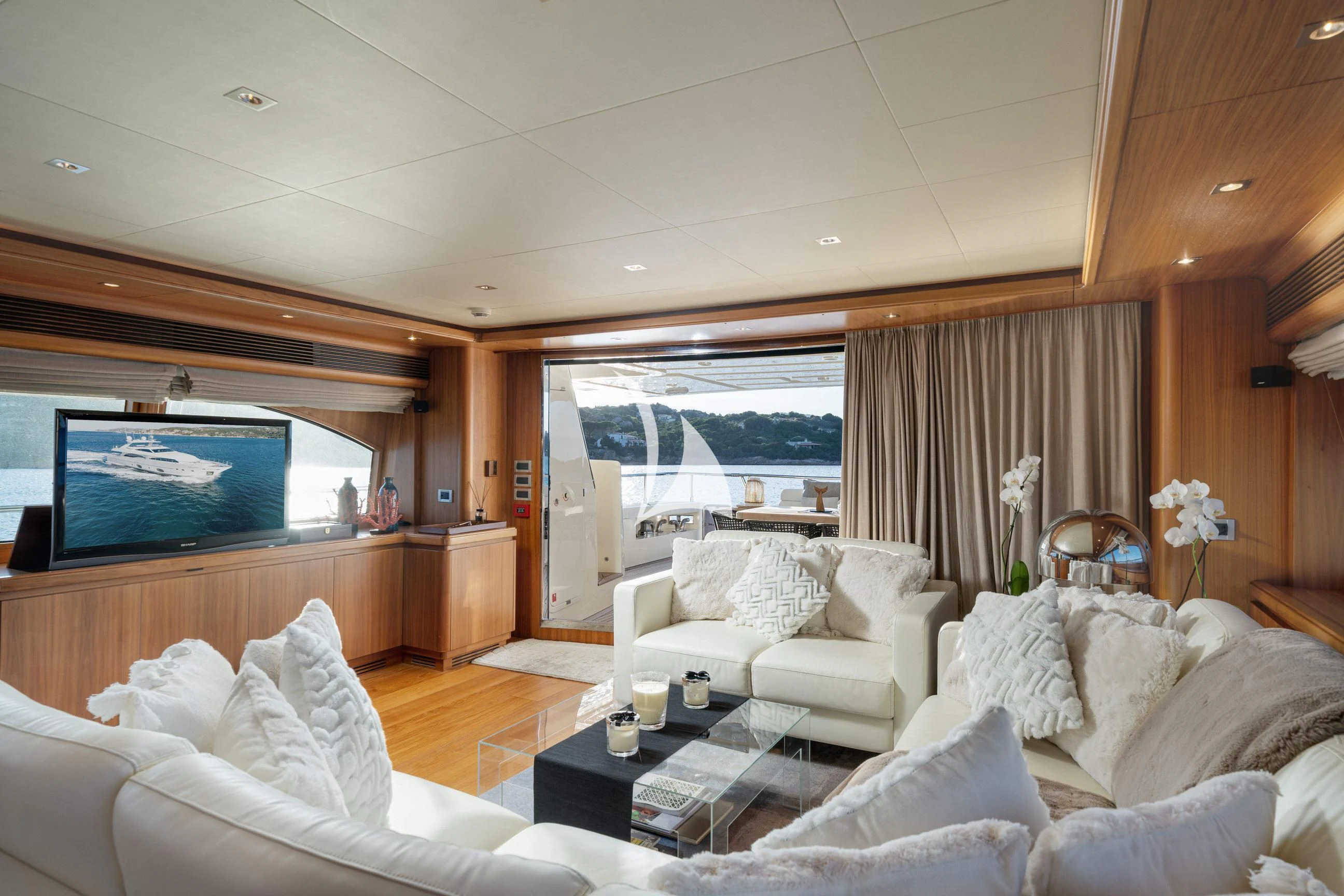a living room with a large screen aboard ETHNA Yacht for Sale