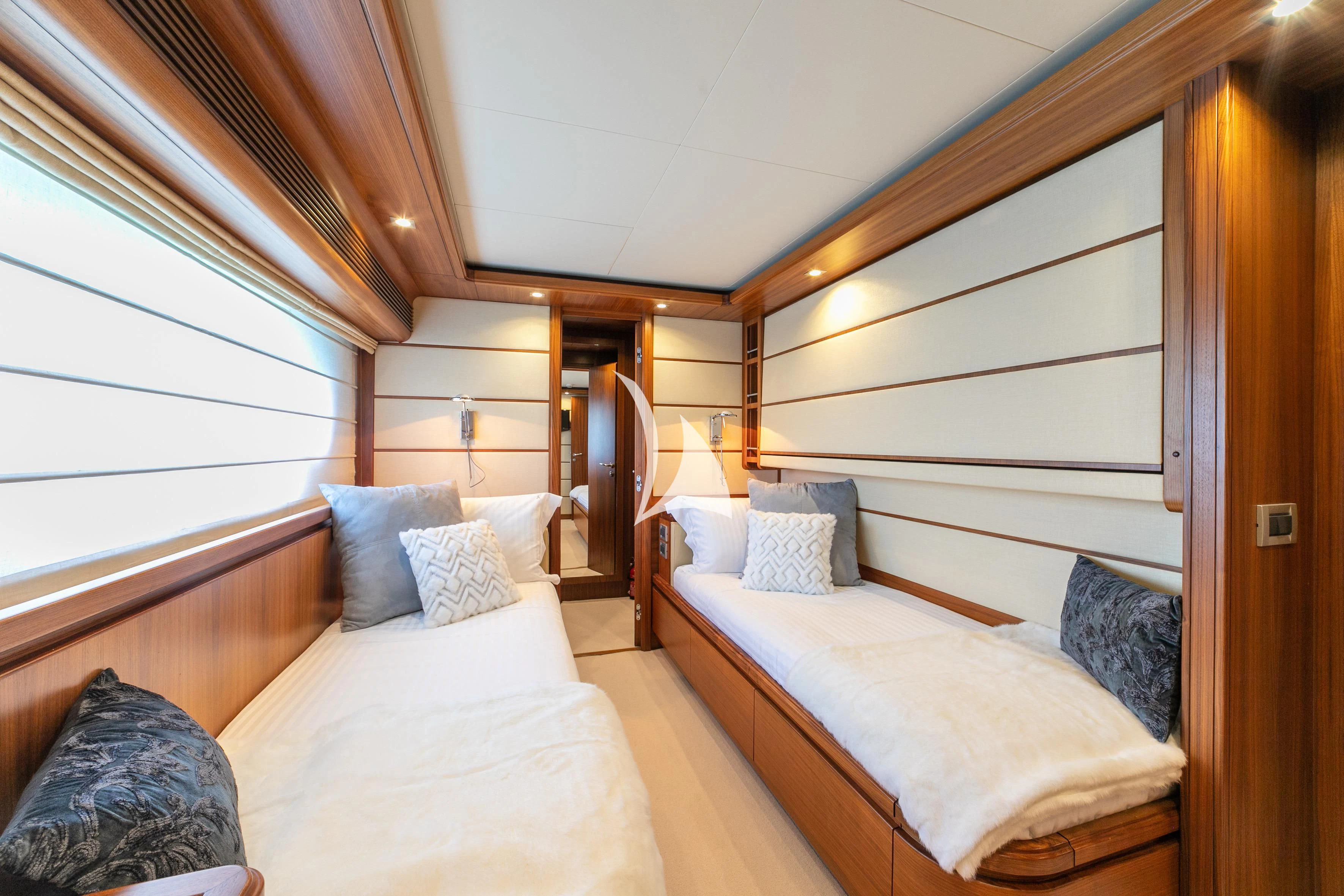 a room with a bed and a window aboard ETHNA Yacht for Sale