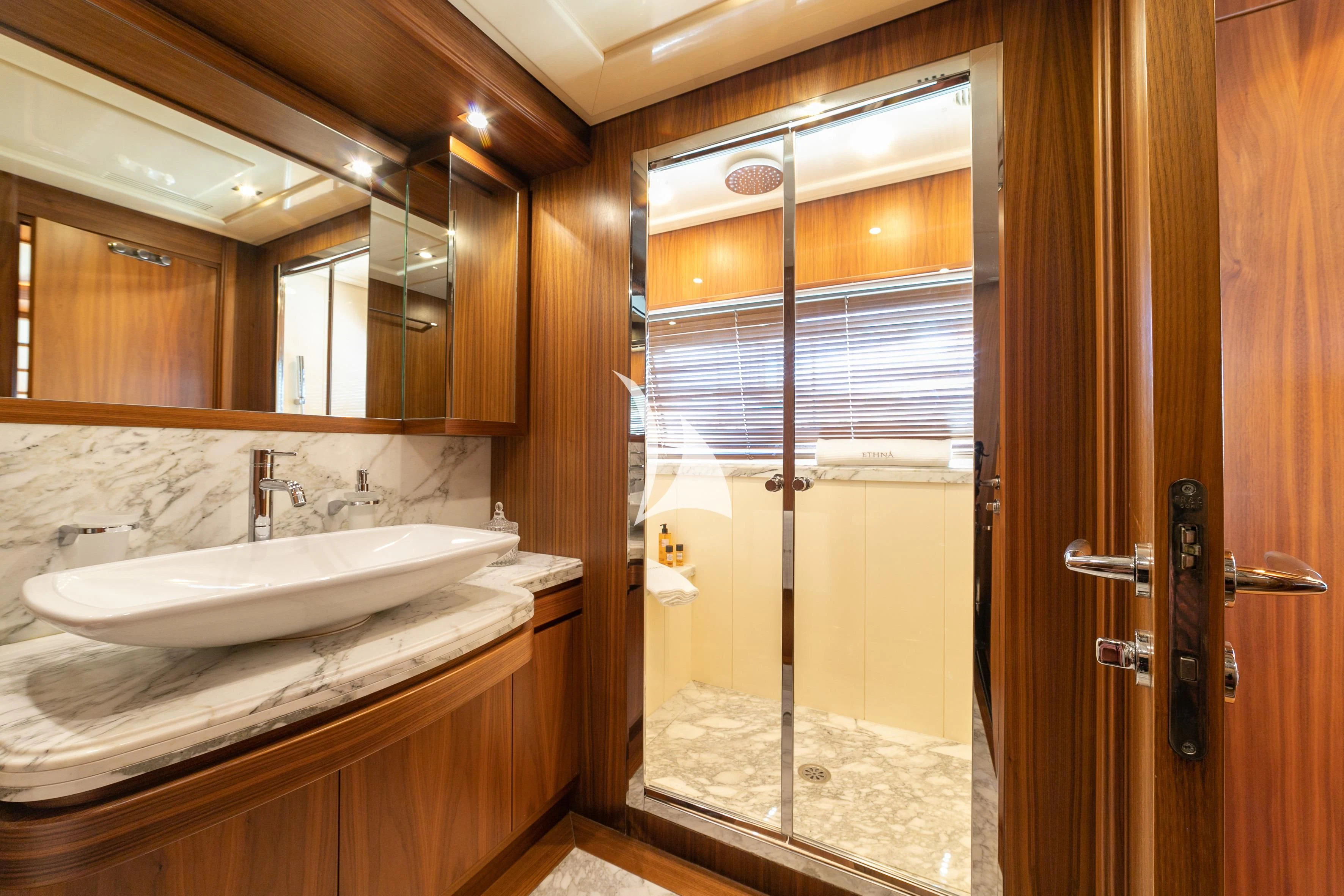 a bathroom with a large mirror aboard ETHNA Yacht for Sale