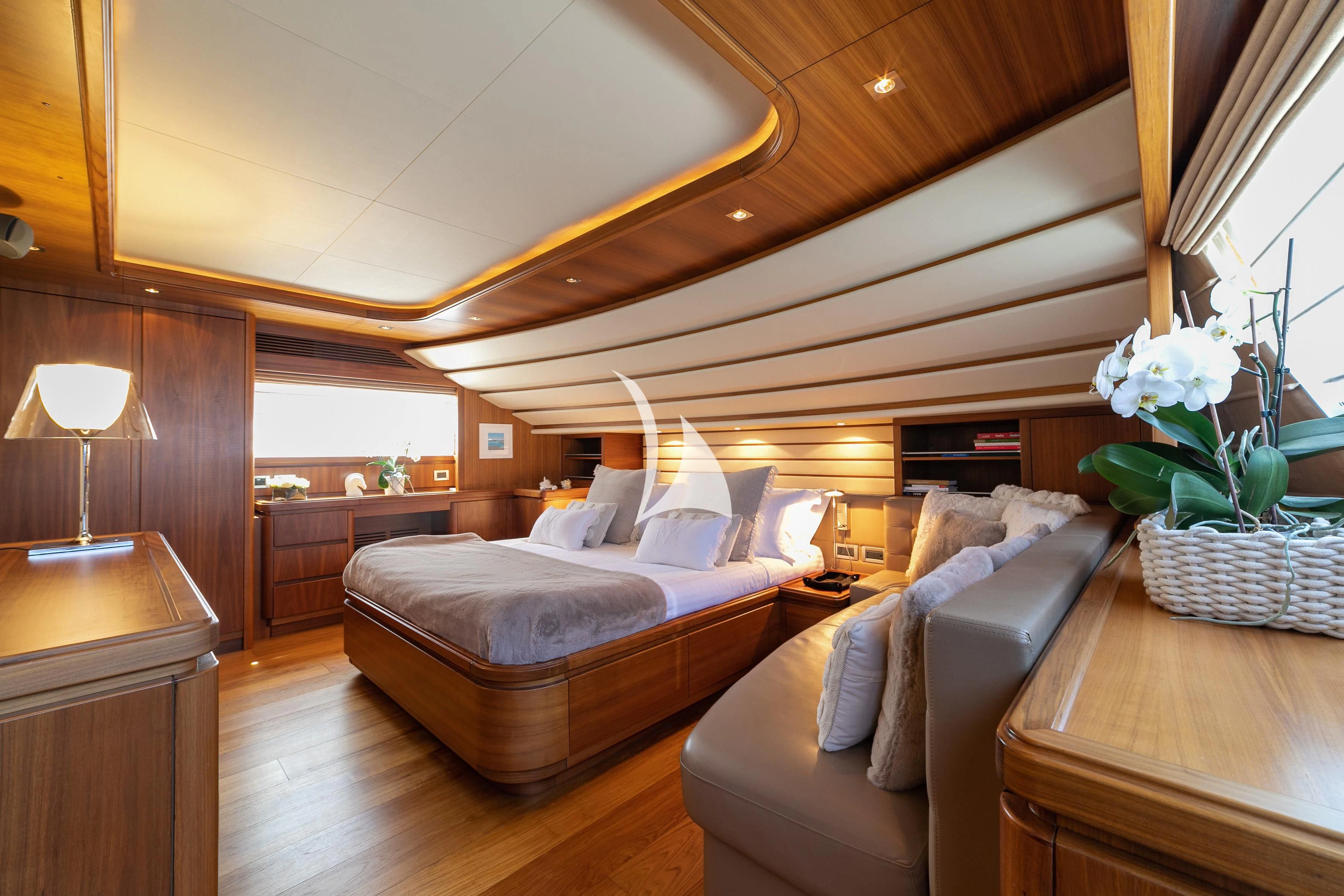 a room with a bed and a table aboard ETHNA Yacht for Sale