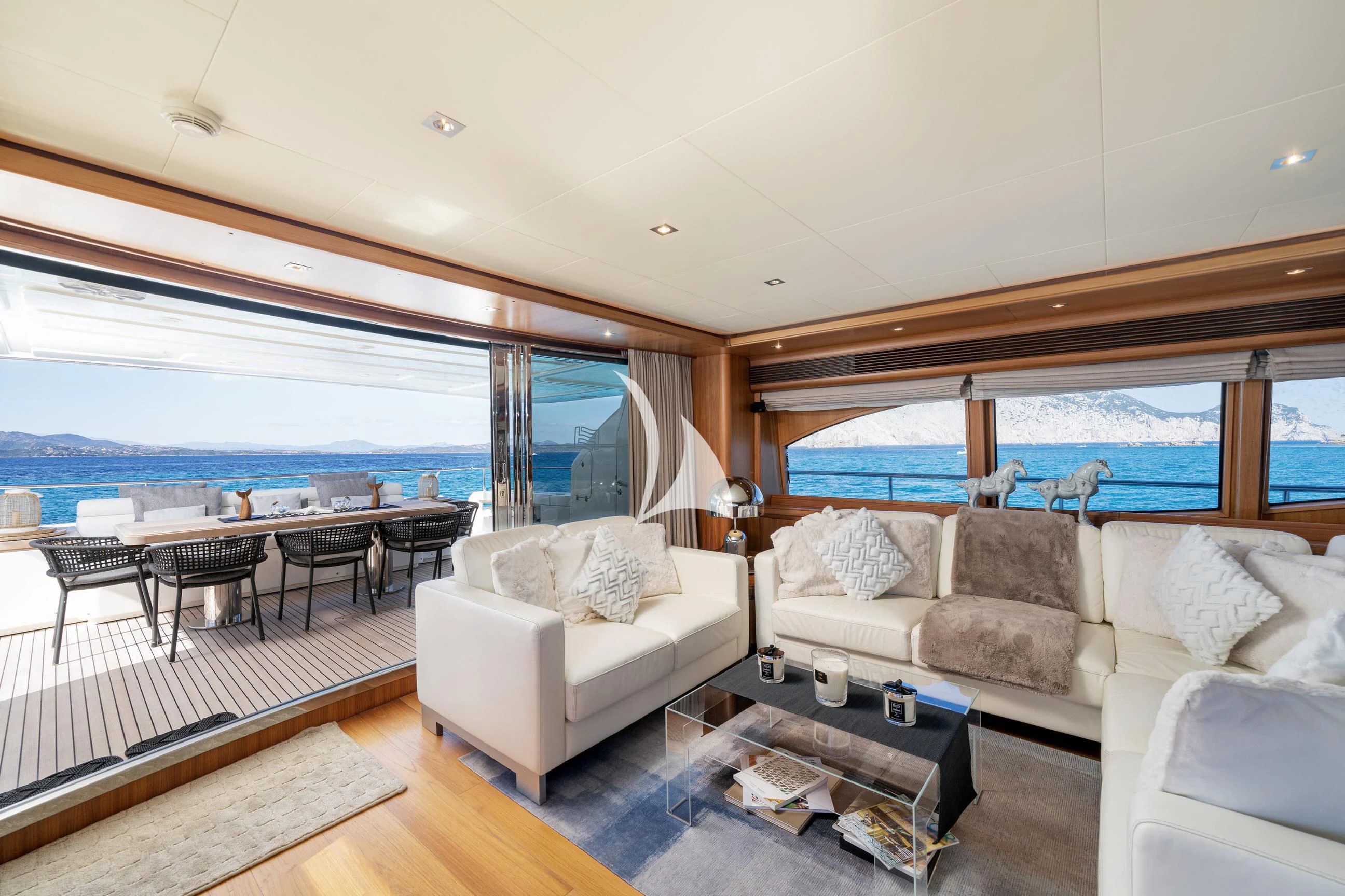 a living room with a large window aboard ETHNA Yacht for Sale