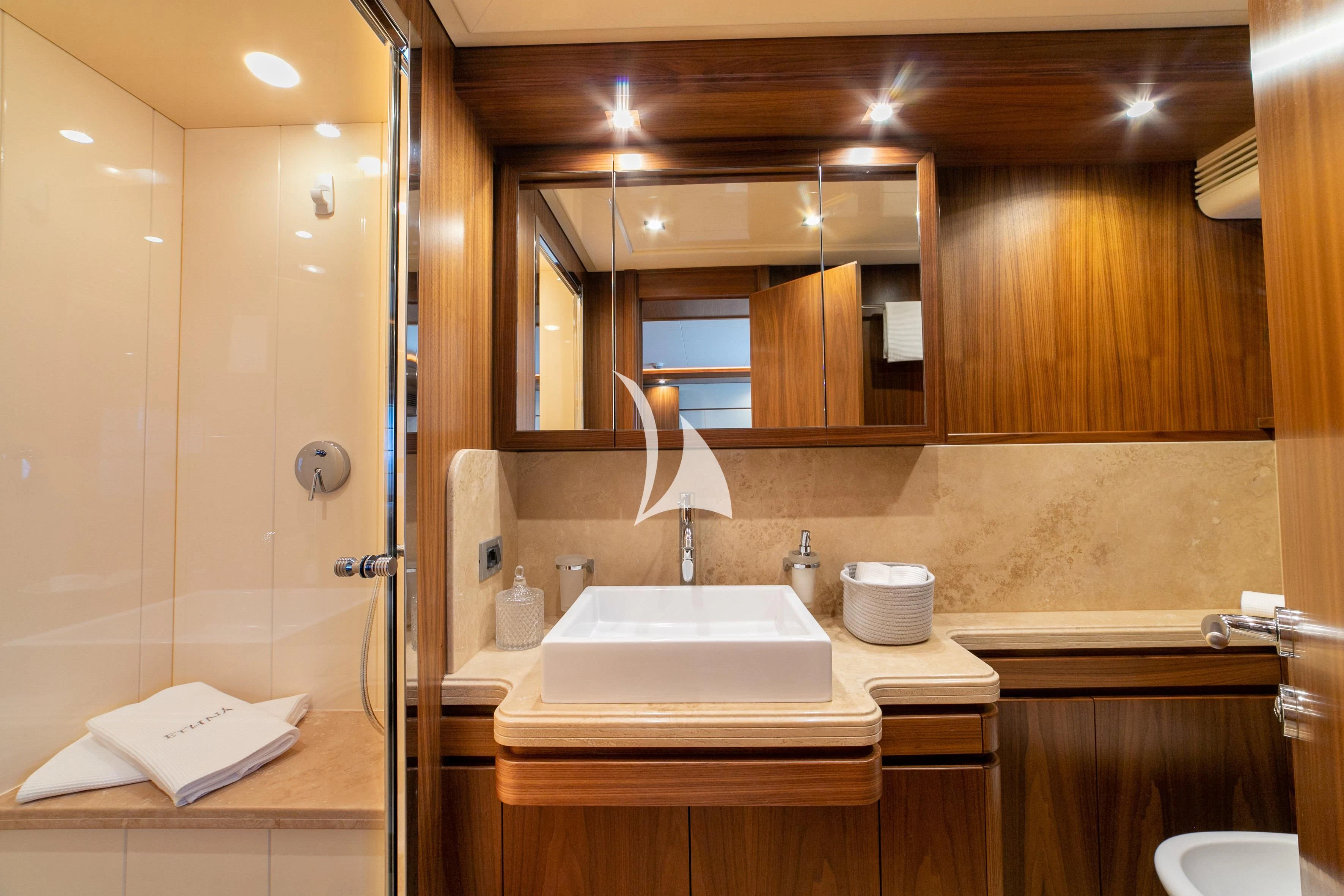 a bathroom with a large mirror aboard ETHNA Yacht for Sale