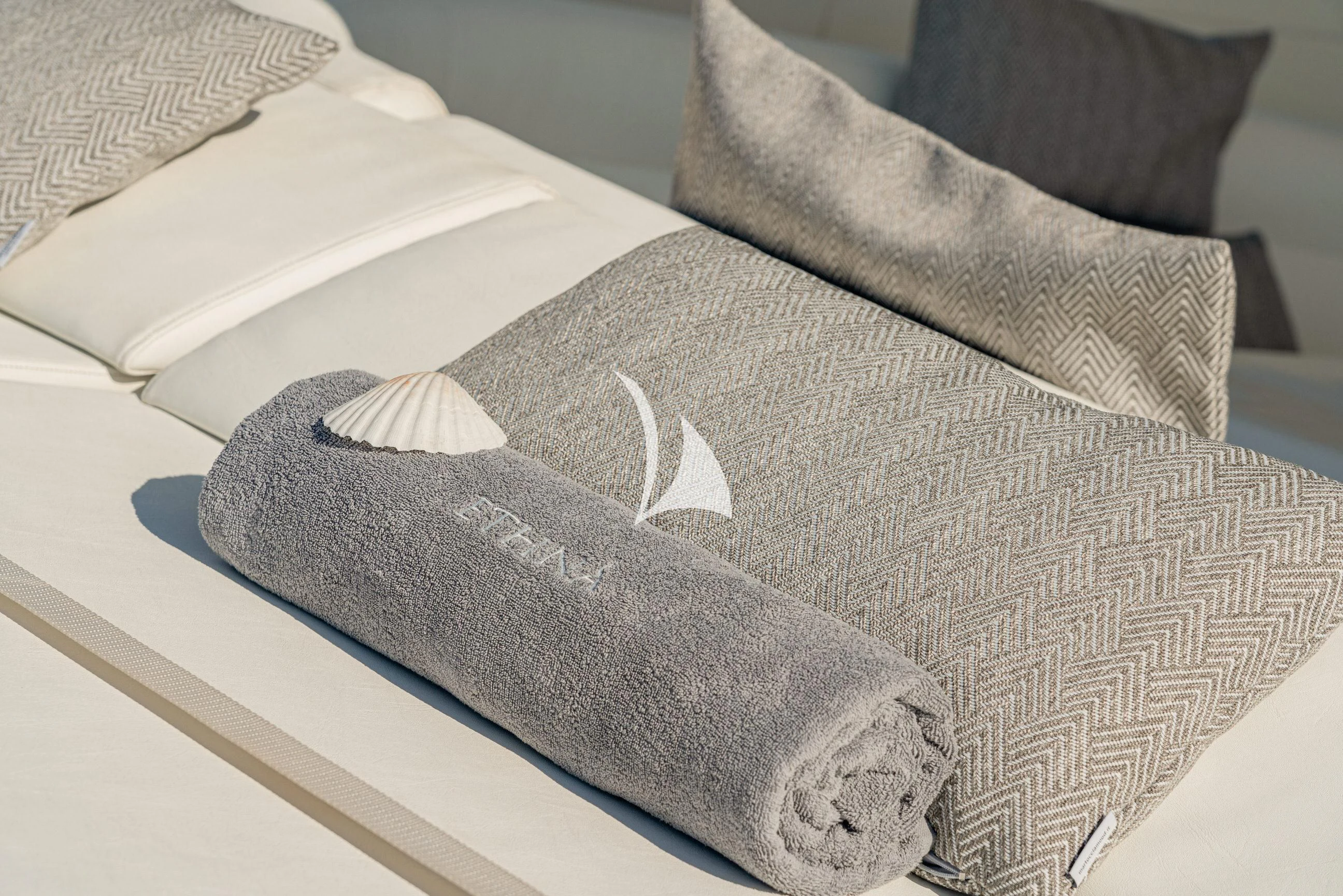 a black hat on a couch aboard ETHNA Yacht for Sale