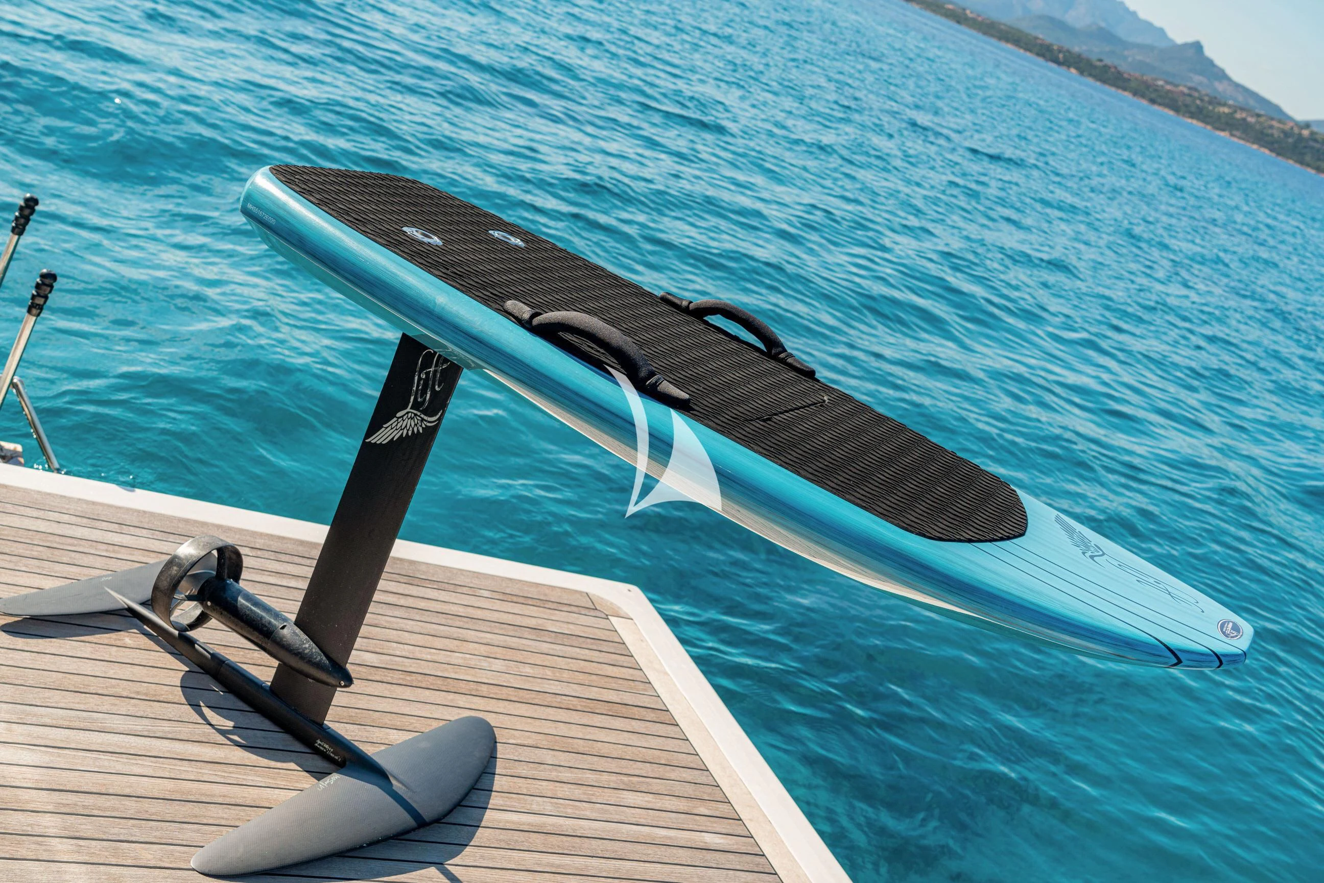 a black and white boat on water aboard ETHNA Yacht for Sale