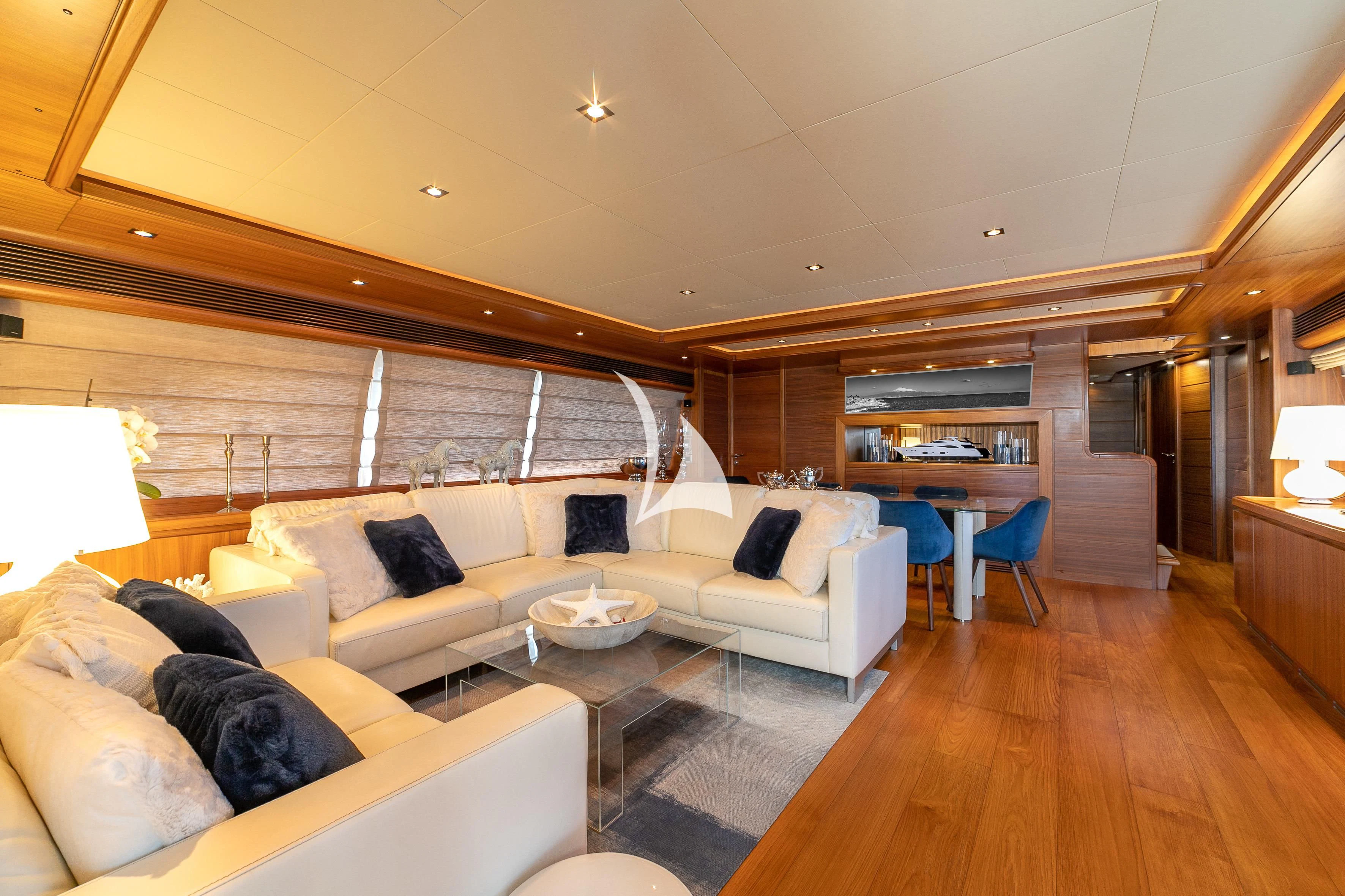 a living room with a wood floor aboard ETHNA Yacht for Sale
