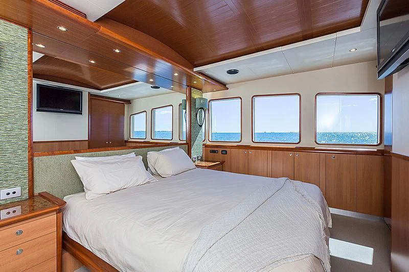 a room with a bed and a window aboard ZIG ZAG Yacht for Sale