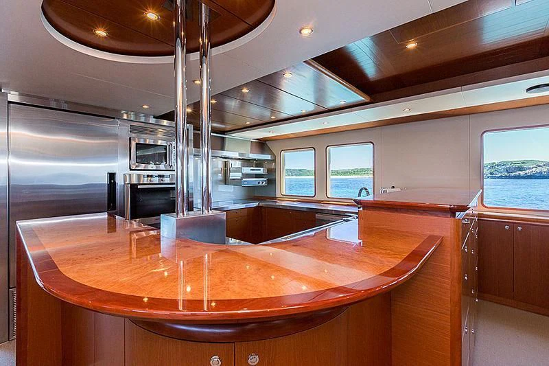 a large wooden table in a room aboard ZIG ZAG Yacht for Sale