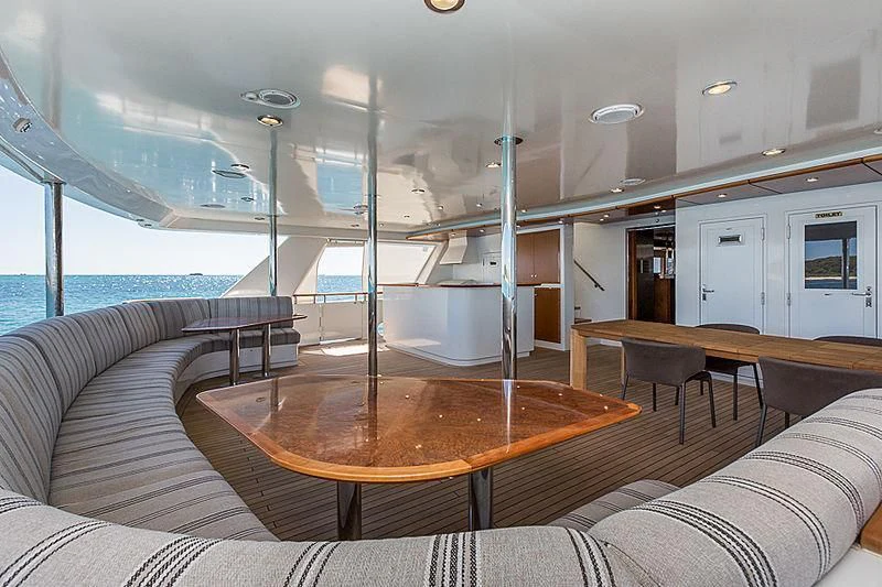 a boat with a table and chairs aboard ZIG ZAG Yacht for Sale