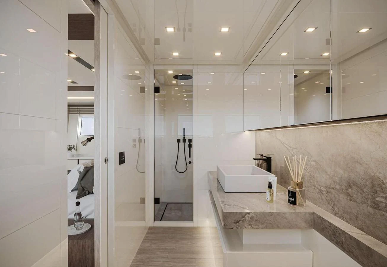 a bathroom with a marble counter top aboard AB80 Yacht for Sale