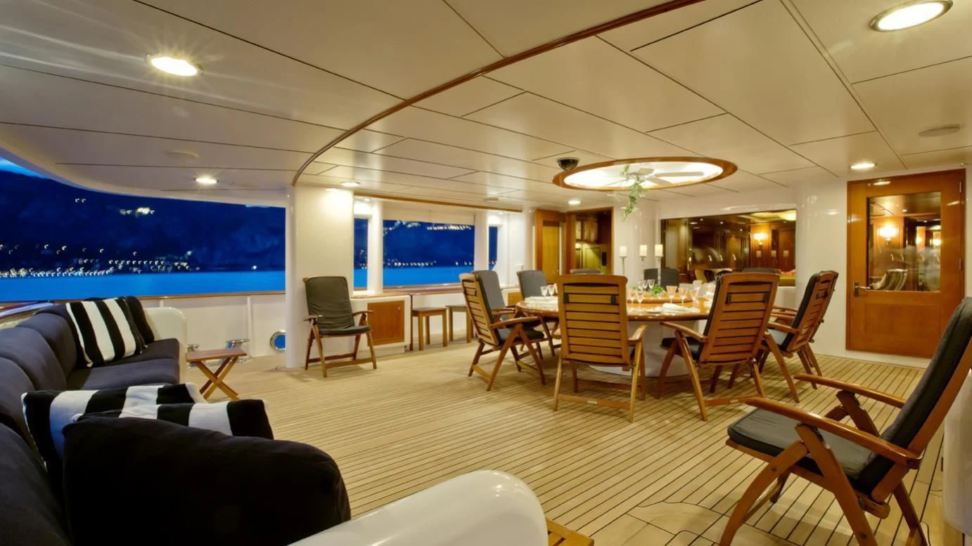 a room with chairs and tables aboard VIXIT Yacht for Sale