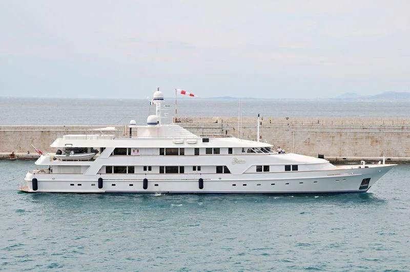 a large white boat in a body of water aboard VIXIT Yacht for Sale