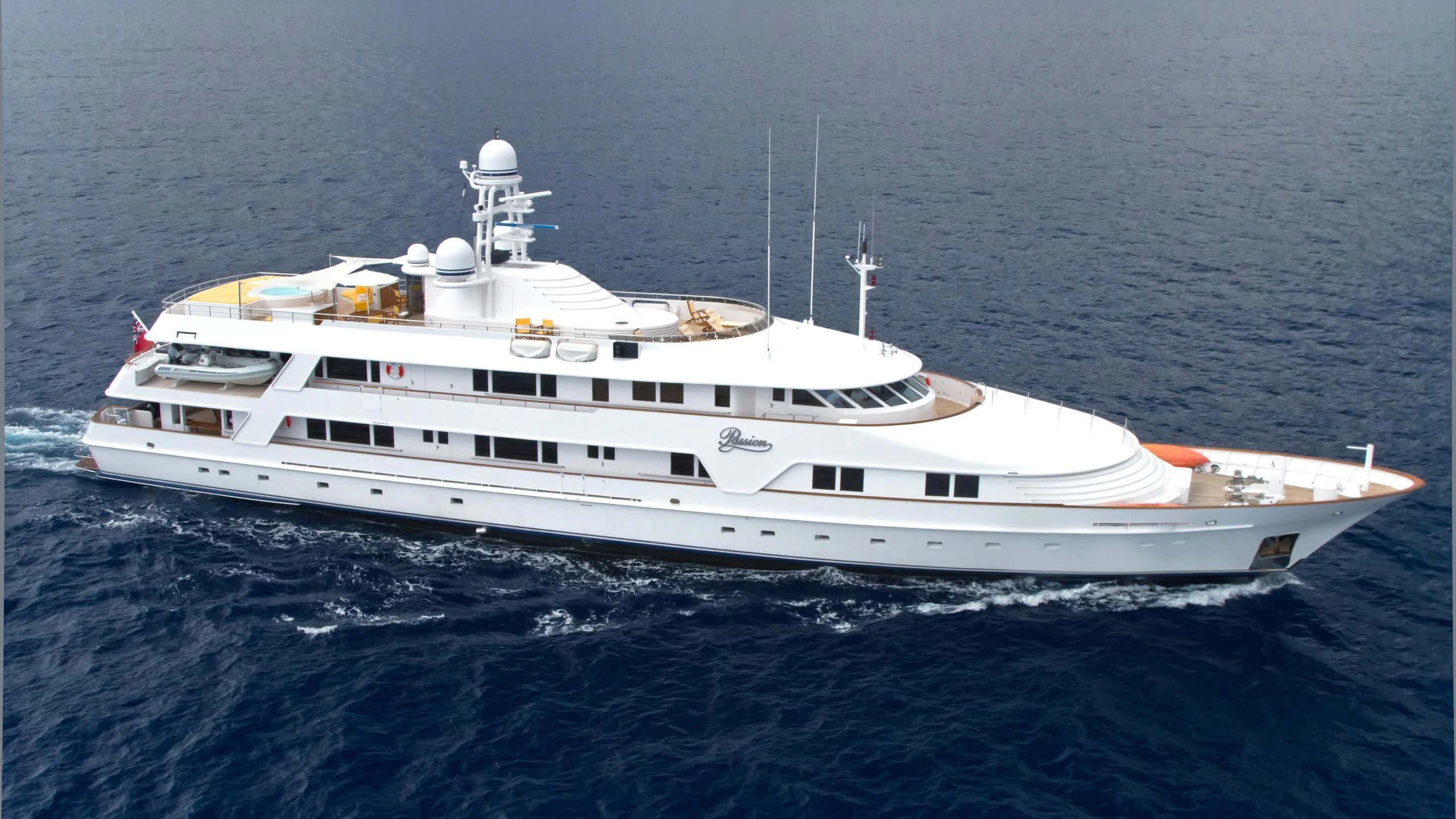 a white yacht in the ocean aboard VIXIT Yacht for Sale